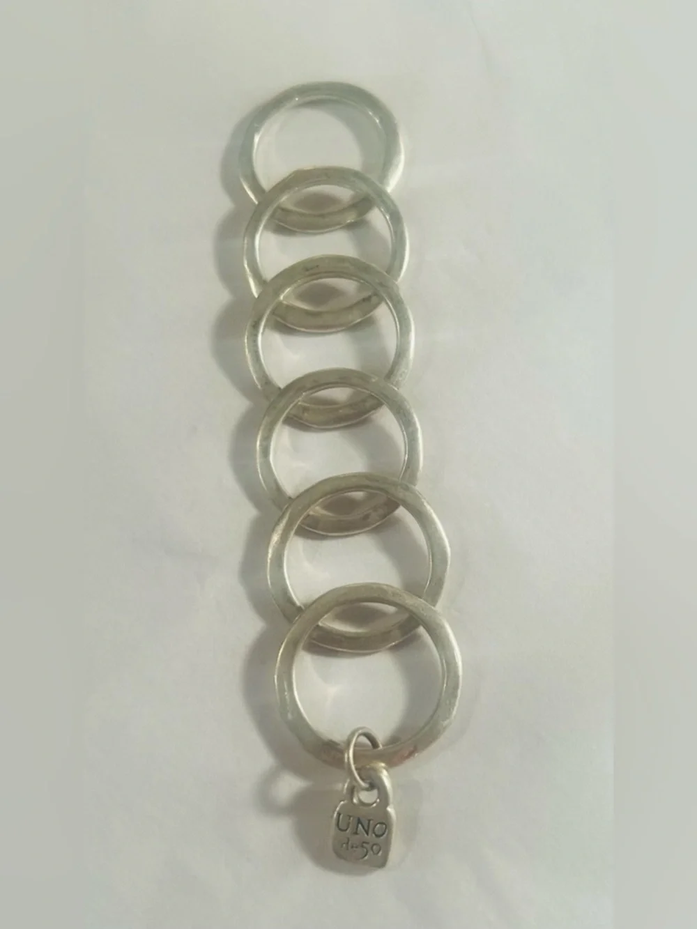 UNO de 50 Silver “prisoner”Multi-Ring Statement with Charm with Gift Pouch